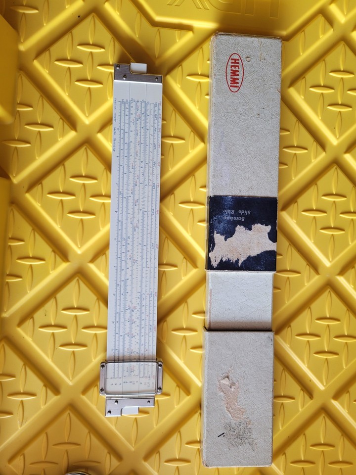 A genuine Hemmi bamboo slide rule made in Japan — analog computing on an exotic material, a tactile piece of pre-digital engineering history.