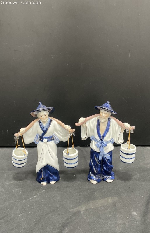 Two Japanese Figurines Of Man And Women Holding Baskets