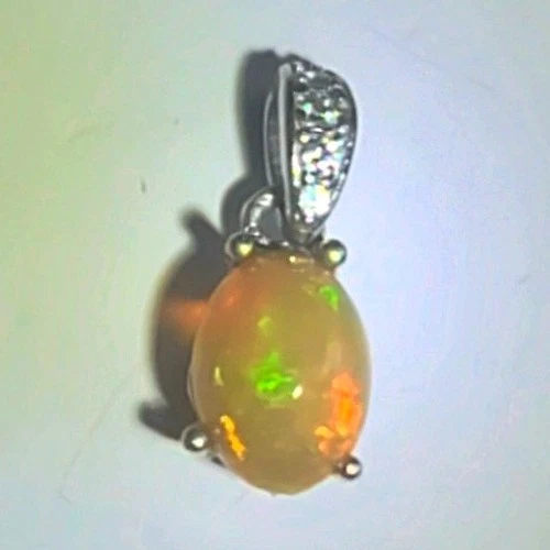 Natural Ethiopian Fire Opal Pendant Opal 7x5mm  in 925 Sterling Silver  - product listing photo