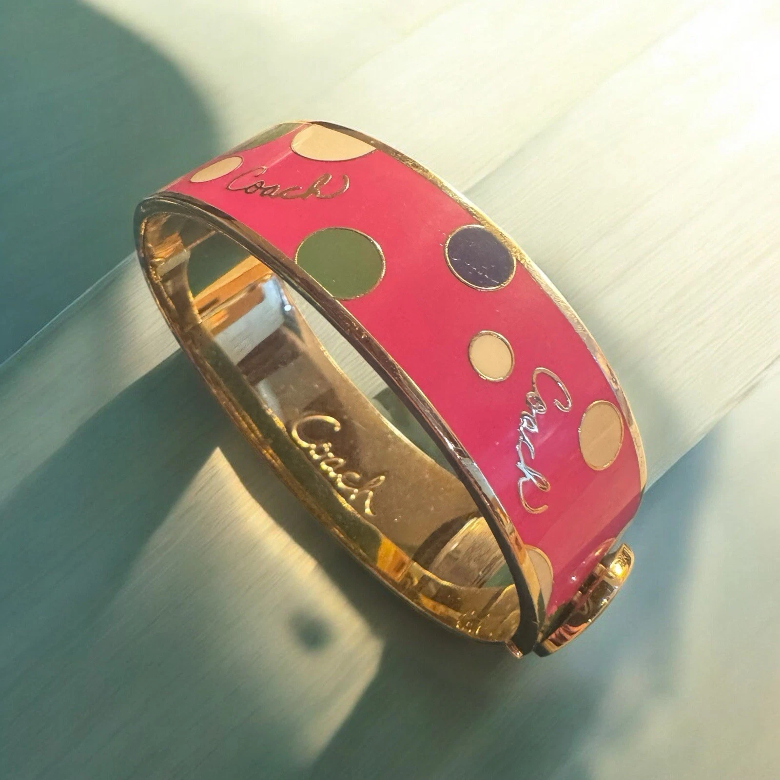 Bracciale Coach rosa a pois multi oro 3 4" con cerniera us intime ottimeioni