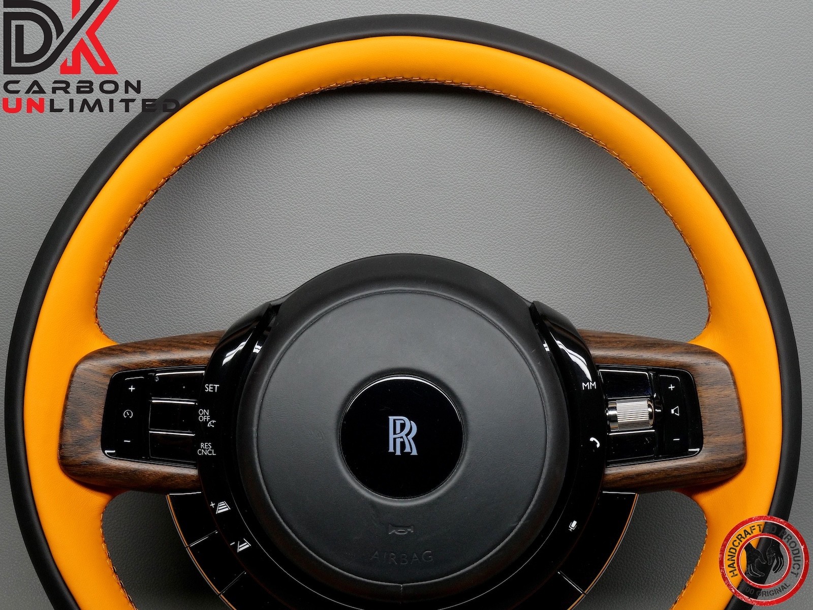 Rolls Royce Spectre Thick Rimmed Two Tone Black & Mandarin Stitch Steering Wheel