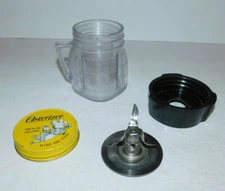 NEAT VINTAGE OSTER OSTERIZER BLEND AND STORAGE 8 OUNCE JAR WITH BLADES