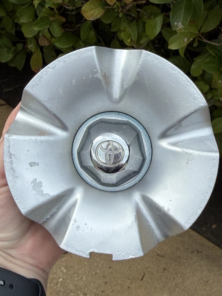 Tapa central de rueda Toyota Celica TRD 99-06 OEM repintada plateada sin cables Foto 2 de 4