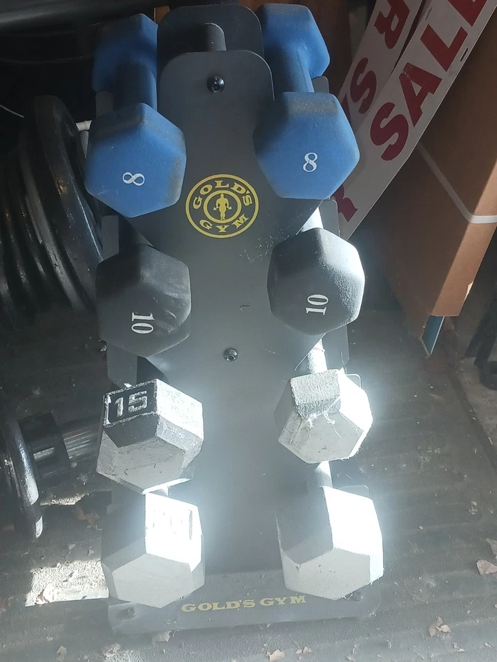 Juego de pesas dorado para gimnasio Foto 2 de 3