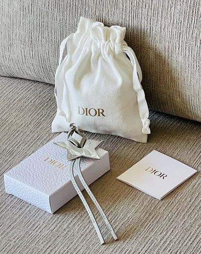 Porte clés Dior Autour du Monde Ton Argent Métal Etoile Sac Charm Téléphone Strap NEUF