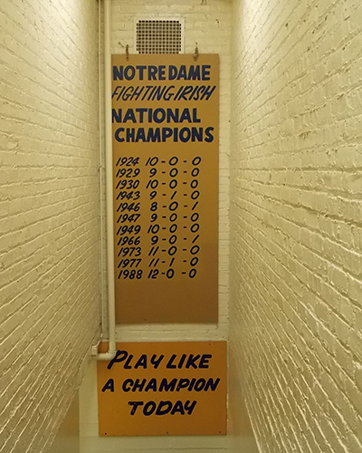 PLAY LIKE A CHAMPION NOTRE DAME FIGHTING IRISH FOOTBALL 8X10 PHOTO