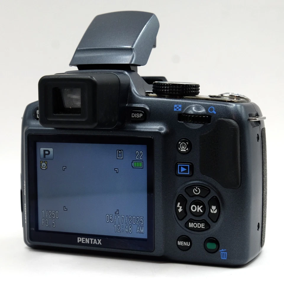 Cargador lente zoom óptico 26x cámara puente digital sensor CCD Pentax X90 12,1 MP Foto 4 de 4