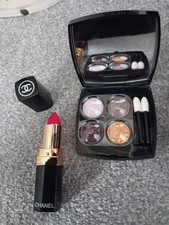 Chanel make up, eye shadow palette and red lipstick, gift bag with sponges