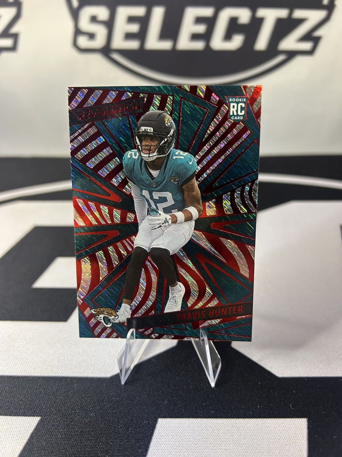 Travis Hunter 2025 Panini Revolution Red Swirl Storm RC #242