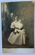 Vintage ca 1900s RPPC Real Photo Postcard Woman with Child sitting on porch AZO