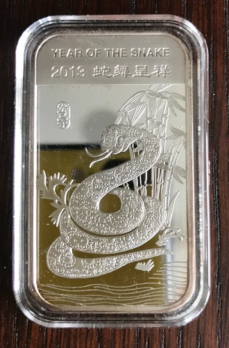 2013 APMEX Year Of The Snake Uncirculated Slightly Toned 1oz .999Fine Silver bar
