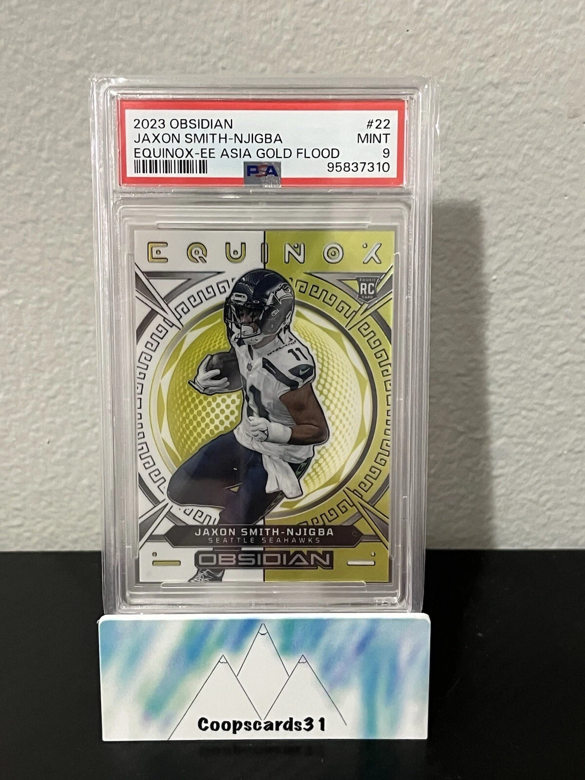 Jaxon Smith-Njigba Panini Obsidian Equinox #22 Electric Etch Asia Gold Flood