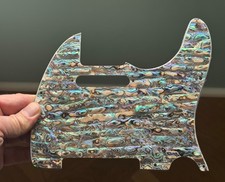 Premium handmade pickguard featuring real mot...