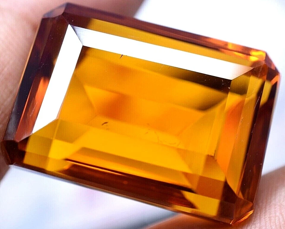 Lab created 89.50 Ct Splendid Golden Orange Topaz GGL Certified Emerald Cut Gem Foto 4 de 4