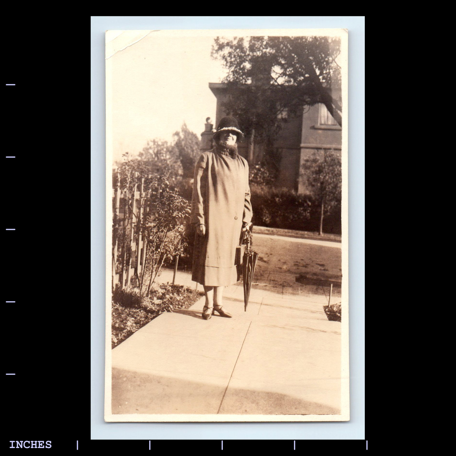 Vintage Portrait of a Woman Holding an Umbrella Black and White  