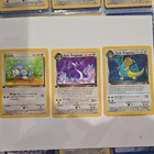 Pokémon Dratini 1st Ed, Dark Dragonair 1st Ed, Dark Dragonite Team Rocket Set.