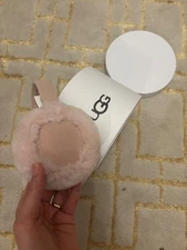 UGG earmuffs color light pink, fur, new in box with tag.