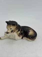 Vintage Shepherd  Collie Dog With Newspaper Ceramic Figurine Cute 3.25” Long