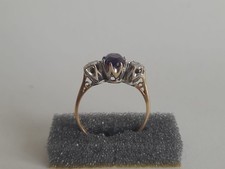 9ct Gold Ring with Silver besle and purple sapphire