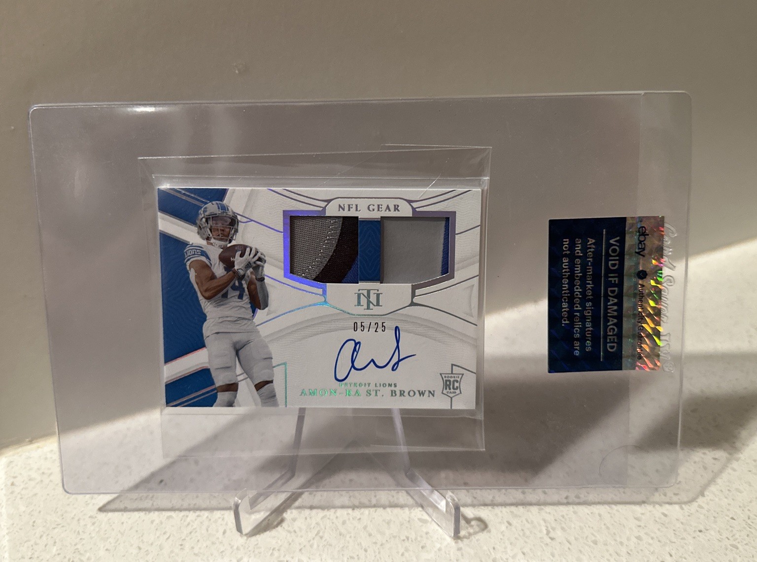 2021 Panini National Treasures Amon-Ra St. Brown NFL Gear RPA Silver 5/25