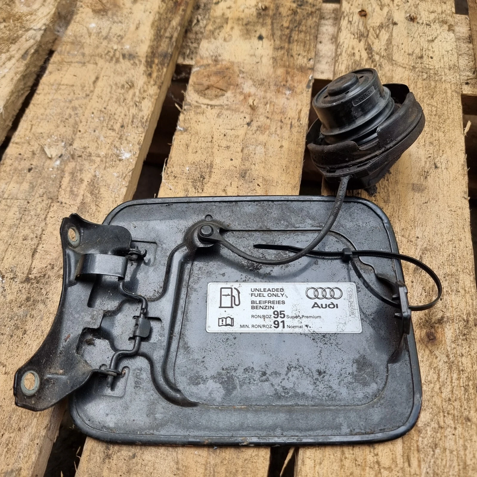 Rear of Audi A4 Cabriolet fuel flap with petrol cap and tether