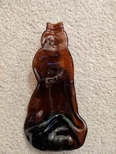 ART DECO GLASS  ASHTRAY. Lady Figure With Crossed Legs & Folded Arms Amber/Brown