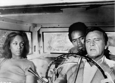 Lola Falana watches as OJ Simpson points gun at Richard Burton fro- Old Photo