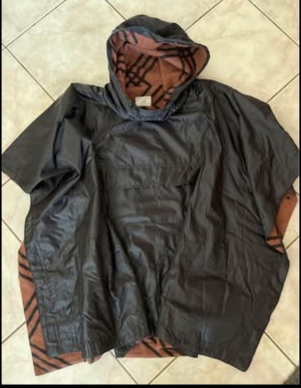 Serra hooded poncho, black, flannel lined, length front 30”, back 31”, one size.