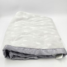 Cloud Island Blanket with a tree pattern and satin trim
