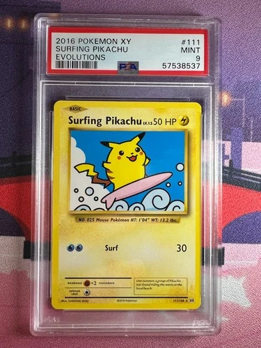 Surfing Pikachu 111/108 XY Evolutions graded PSA 9, sealed in a PSA slab with the grading label and certification number visible