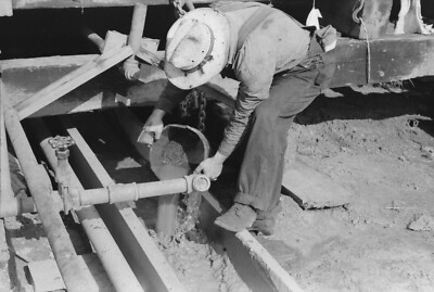 8'' x 10'' Photo Oil field worker examining mud