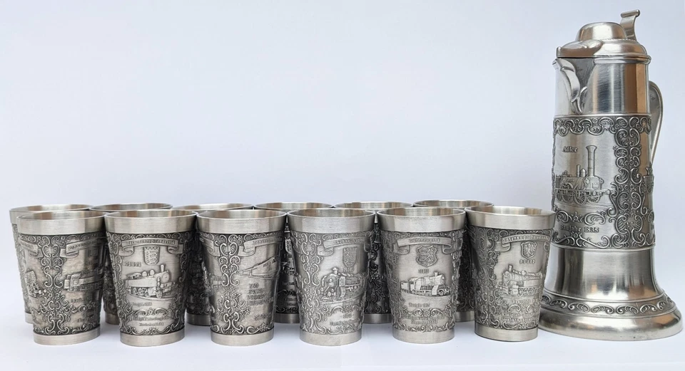 EISENBAHN-ZINNKRUG und 12 BECHER,aus 1835-1985, WERTZINN DESIGN STUTTGART