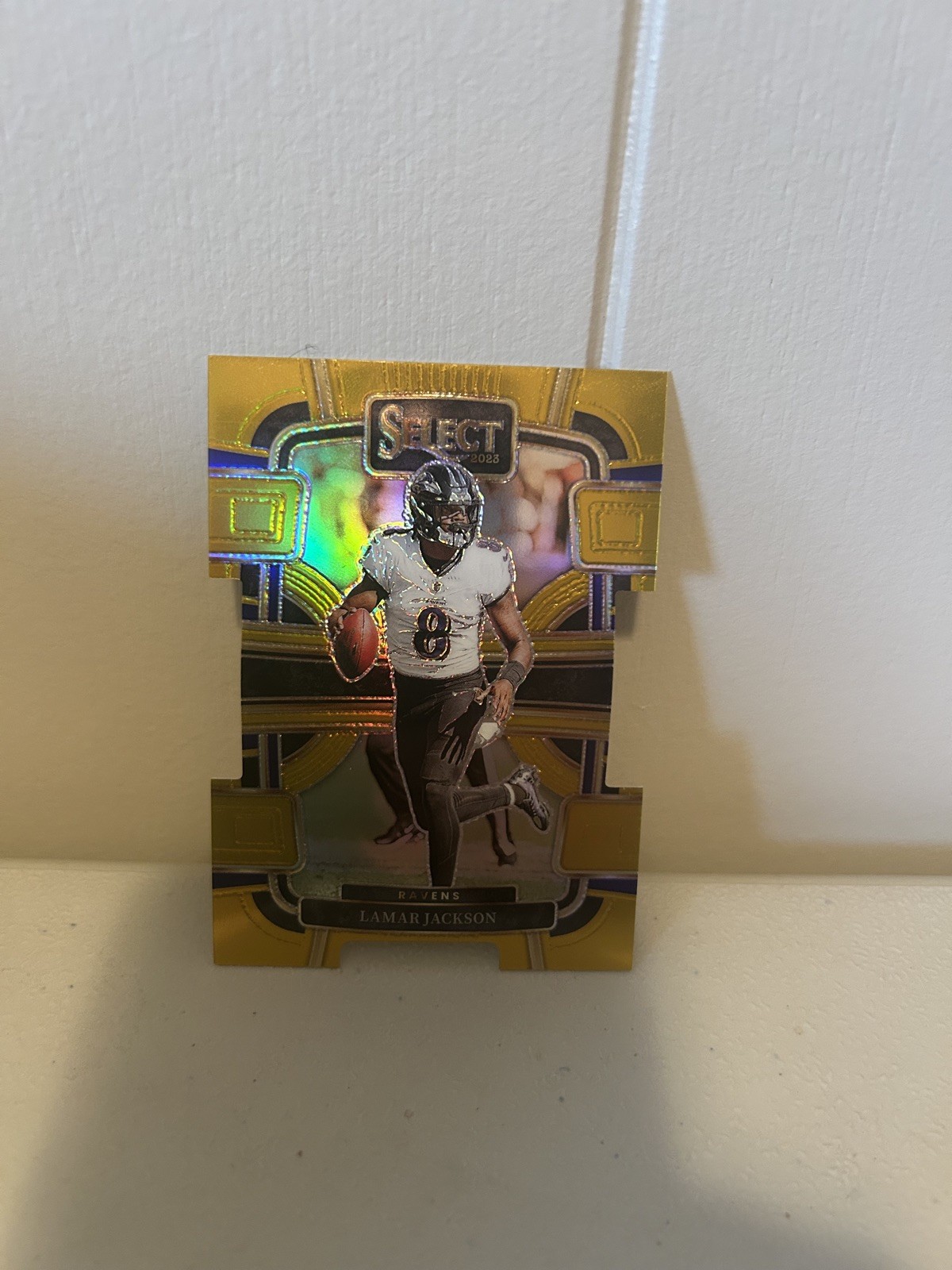 2023 Panini Select - Concourse Lamar Jackson #7 Gold Prizm Die-Cut /10