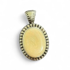 Silver pendant with oval cream colored