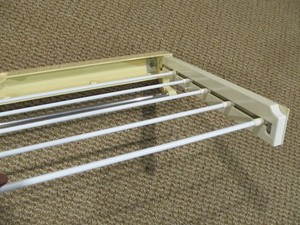 older used Polder wall mount pullout clothes drying rack