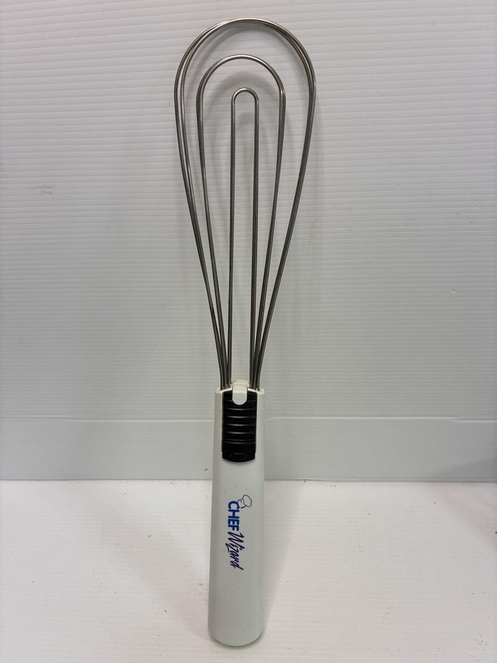 A weird and wonderful hybrid spring-whisk-meets-tongs gadget from the 'Chef Wizard' era — a genuinely obscure retro kitchen oddity most people have never seen.