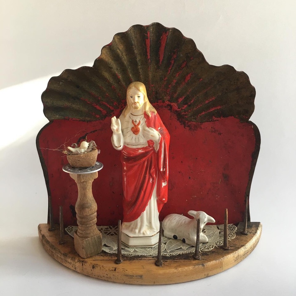 A handcrafted religious shrine assemblage built from upcycled objects — irreverent, deeply personal folk art that belongs on a very specific someone's altar.