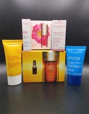 CLARINS 5 Piece Travel Sample Set Hydra Essentiel Cleanser Double Serum Lip Oil