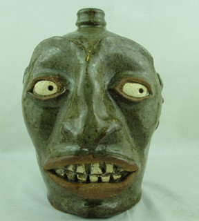Face Jug w/ Teeth Stamped "Ferrell Maker" (Stephen) Edgefield SC Green/Brown Gl