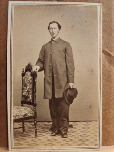 Cdv of unidentified soldier wearing a large sack coat w/Rochester, NY, backmark