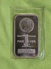 1 oz Silver Morgan Bar minted by the Highland Mint (HM).  .999+ Fine