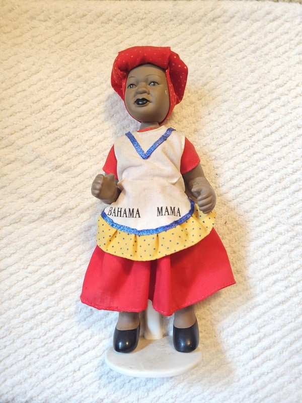 Bahama Mama porcelain souvenir 8 " doll with stand.
