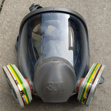used grey 3M safety full face respirator mask with two 3M filters