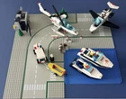 Vintage Lego System Sets: 6344, 6545, boats, minifigs, manuals, and baseplates