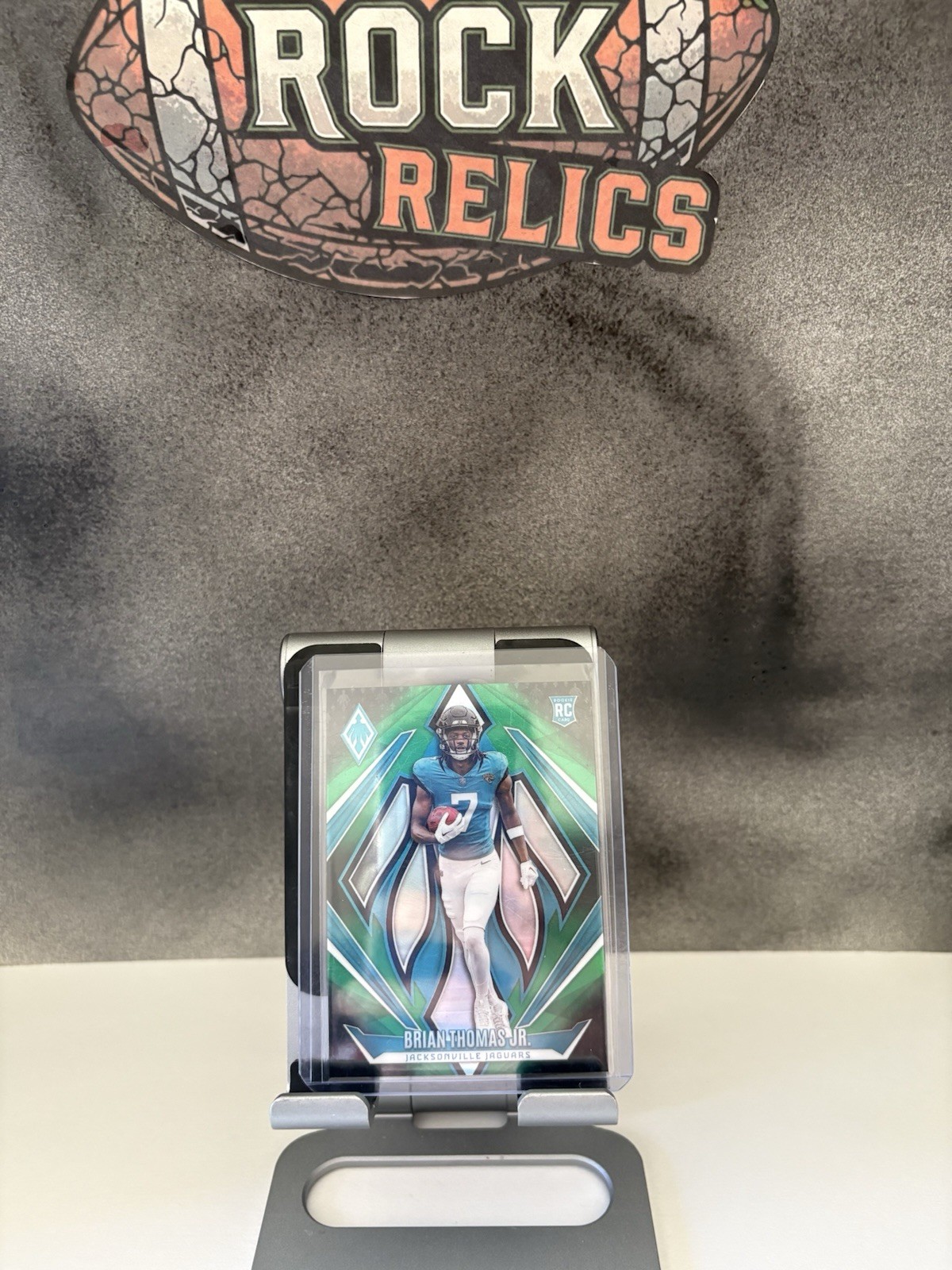 2024 Panini Phoenix - Rookies Brian Thomas Jr. #164 Green Fade /199 (RC)