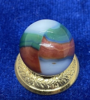 A Vintage Marble King Blended Three Color Marble. Measures .62  Mint Condition.