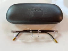 SILHOUETTE Rimless Eyeglasses 7779 40 6055 ..17 140 Brown/Tan Frame w/Case