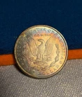 (#103018) Morgan Dollar:  1887   BU.  Rainbow reverse!!!  (see video!)