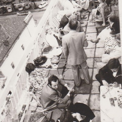 Rooftop Party Seen From Above With Tables Laughter Balcony City Shadows Vintage