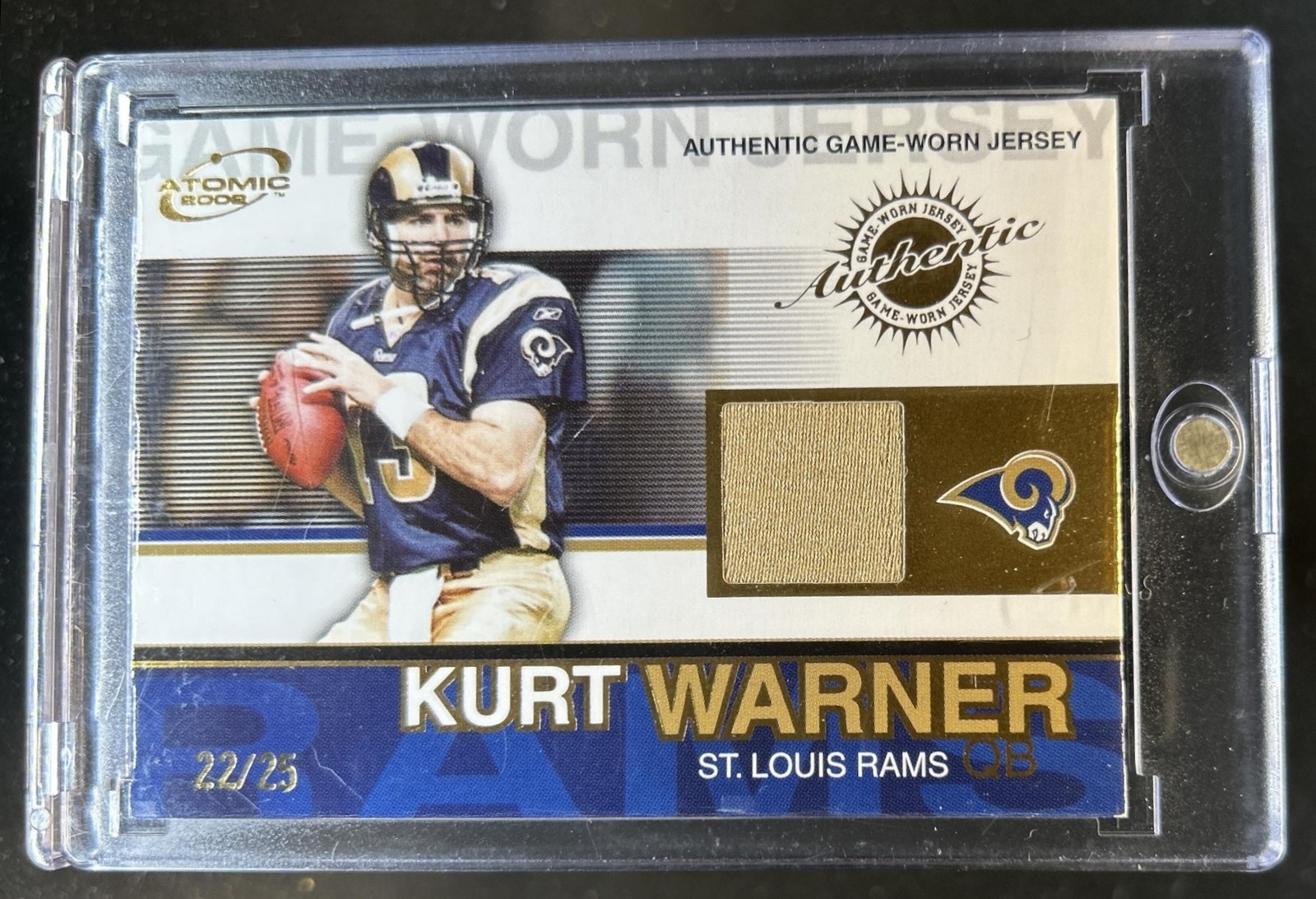 2002 Pacific Atomic Kurt Warner Gold Authentic Game Used Jersey #/25 Rams